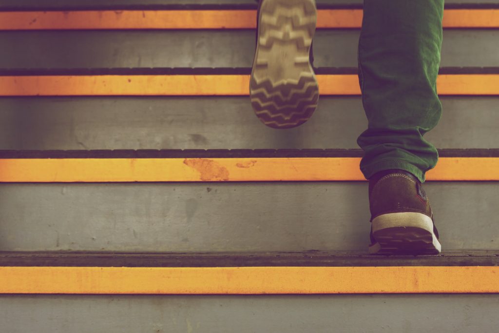 A person slipping and steps and taking a fall at a business.