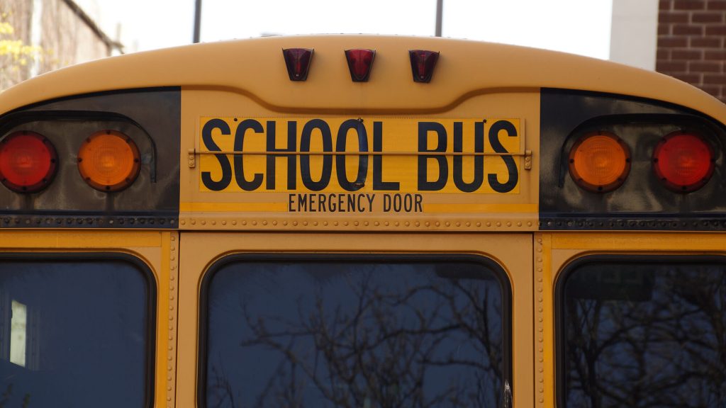 School bus in school zone driving safely in Rio Rancho.